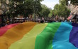 A giant rainbow flag at the 2011 Toulouse LGBT Pride march, by Léna (Own work) [CC-BY-SA-3.0] via Wikimedia Commons.